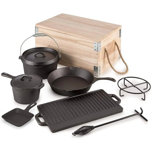 Cast iron camping cookware with wooden box for outdoor family BBQ.